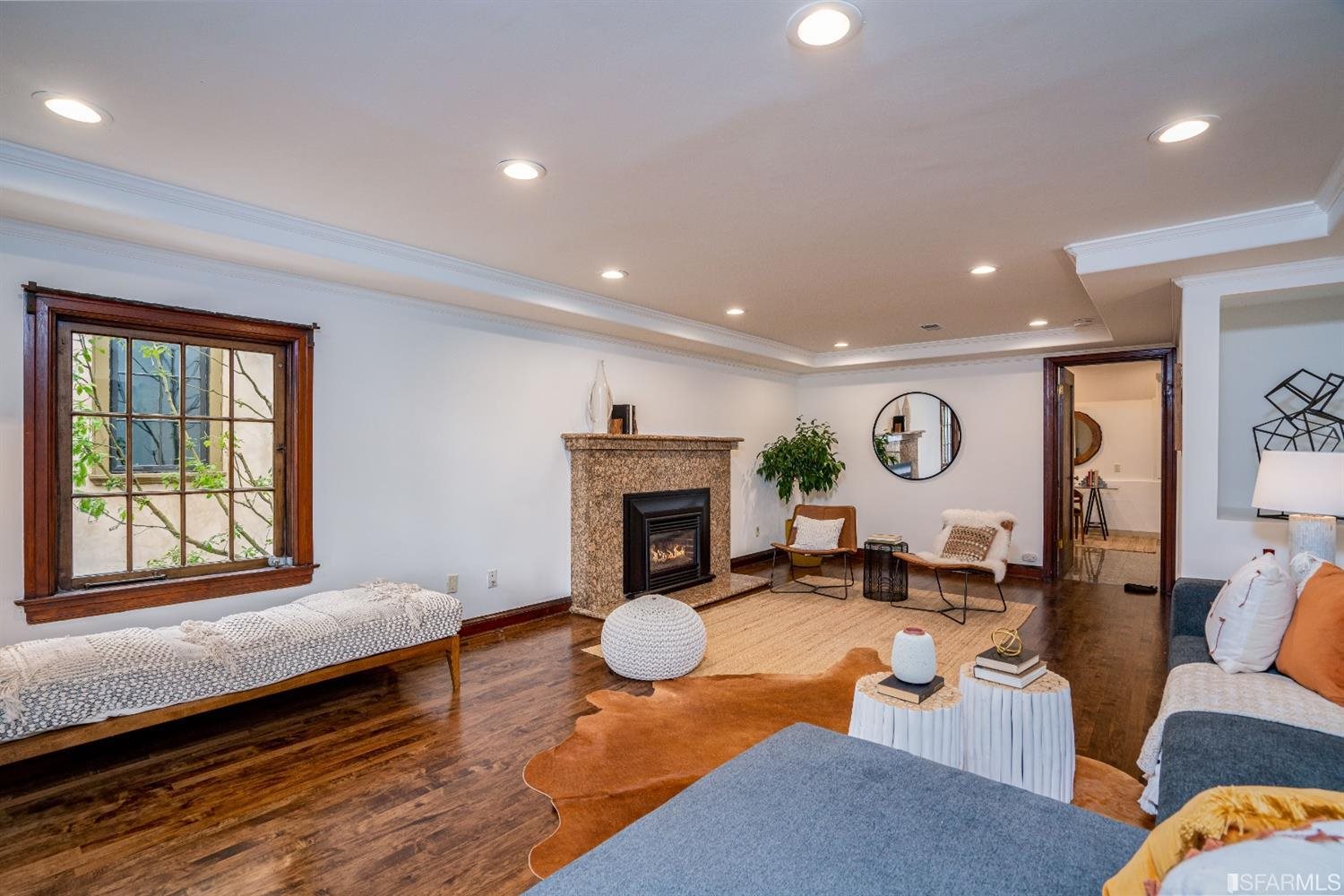 369 Pacheco Street San Francisco, CA 94116 - Photo 29 of 49 a living room with furniture and a fireplace