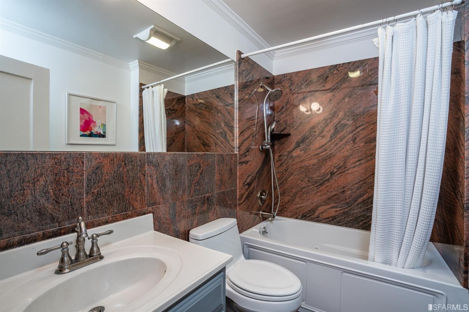 369 Pacheco Street San Francisco, CA 94116 - Photo 31 of 49 a bathroom with a sink and a mirror
