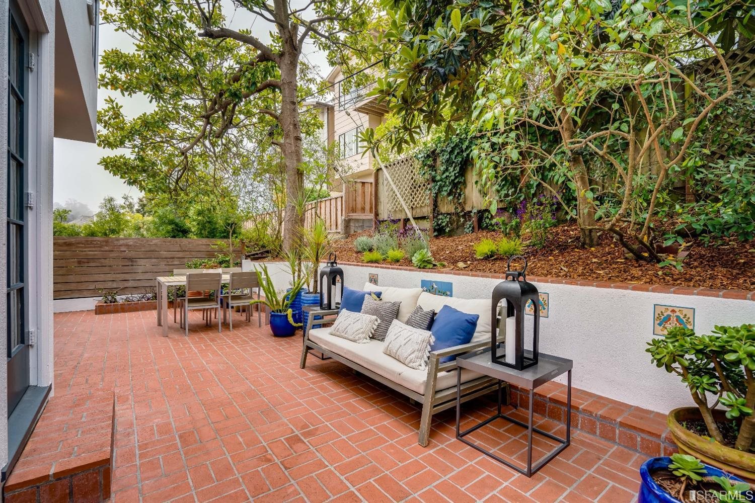 369 Pacheco Street San Francisco, CA 94116 - Photo 45 of 49 a terrace with outdoor seating and trees