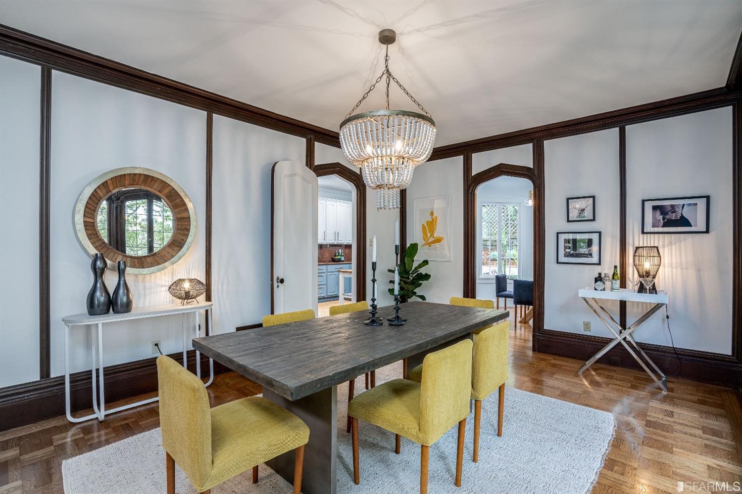 369 Pacheco Street San Francisco, CA 94116 - Photo 9 of 49 a view of a dining room with furniture and a chandelier