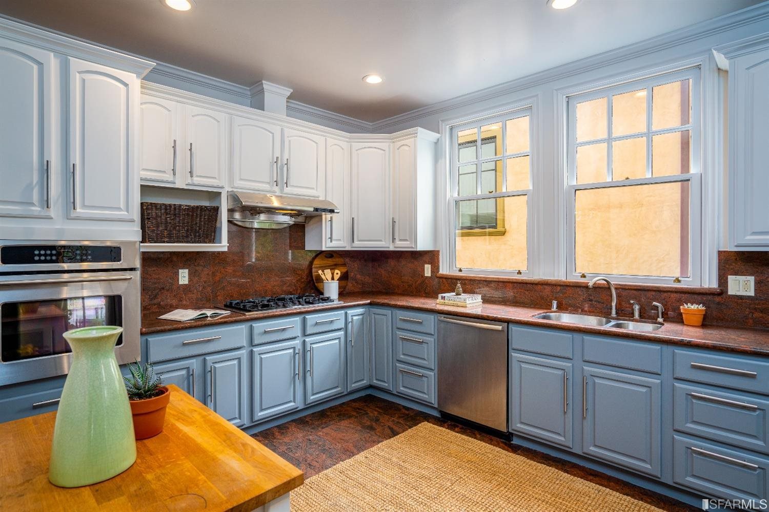 369 Pacheco Street San Francisco, CA 94116 - Photo 10 of 49 a kitchen with stainless steel appliances granite countertop a sink a stove and cabinets