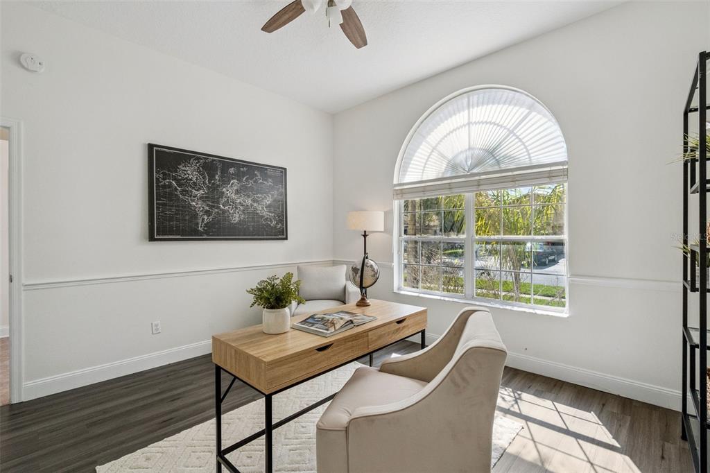 2541 Teton Stone Run Orlando, FL 32828 - Photo 32 of 82 a dining room with furniture a rug and a large window