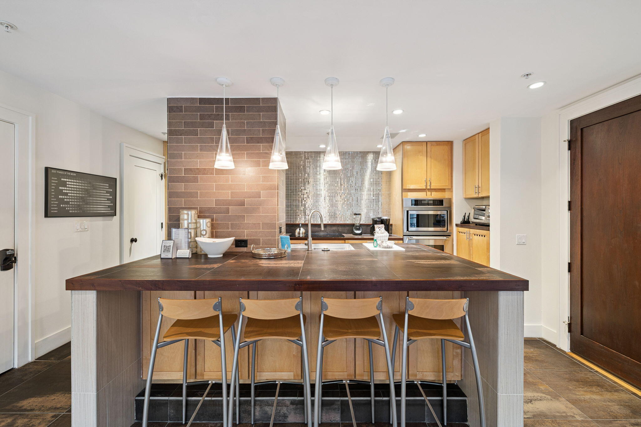 246 Fisherman's Cove, Unit 246 Miramar Beach, FL 32550 - Photo 13 of 72 a kitchen with stainless steel appliances granite countertop a sink and a refrigerator