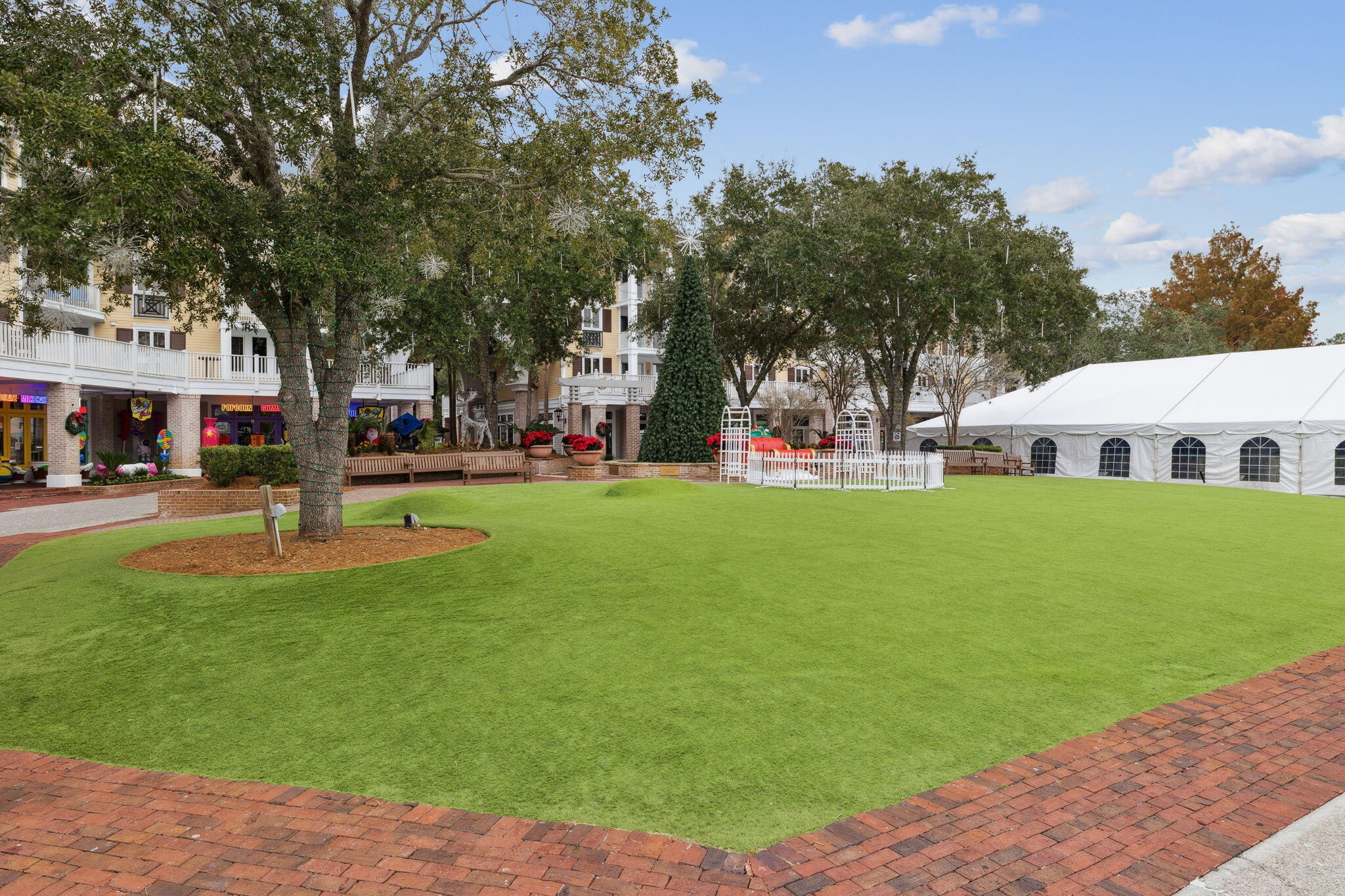 246 Fisherman's Cove, Unit 246 Miramar Beach, FL 32550 - Photo 36 of 72 a front view of a building with a garden and trees
