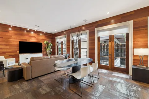 a view of a porch with wooden floor and stairs