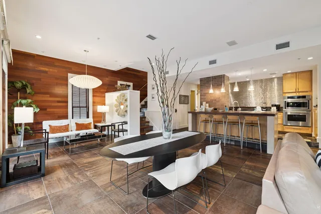 a living room with furniture and a table