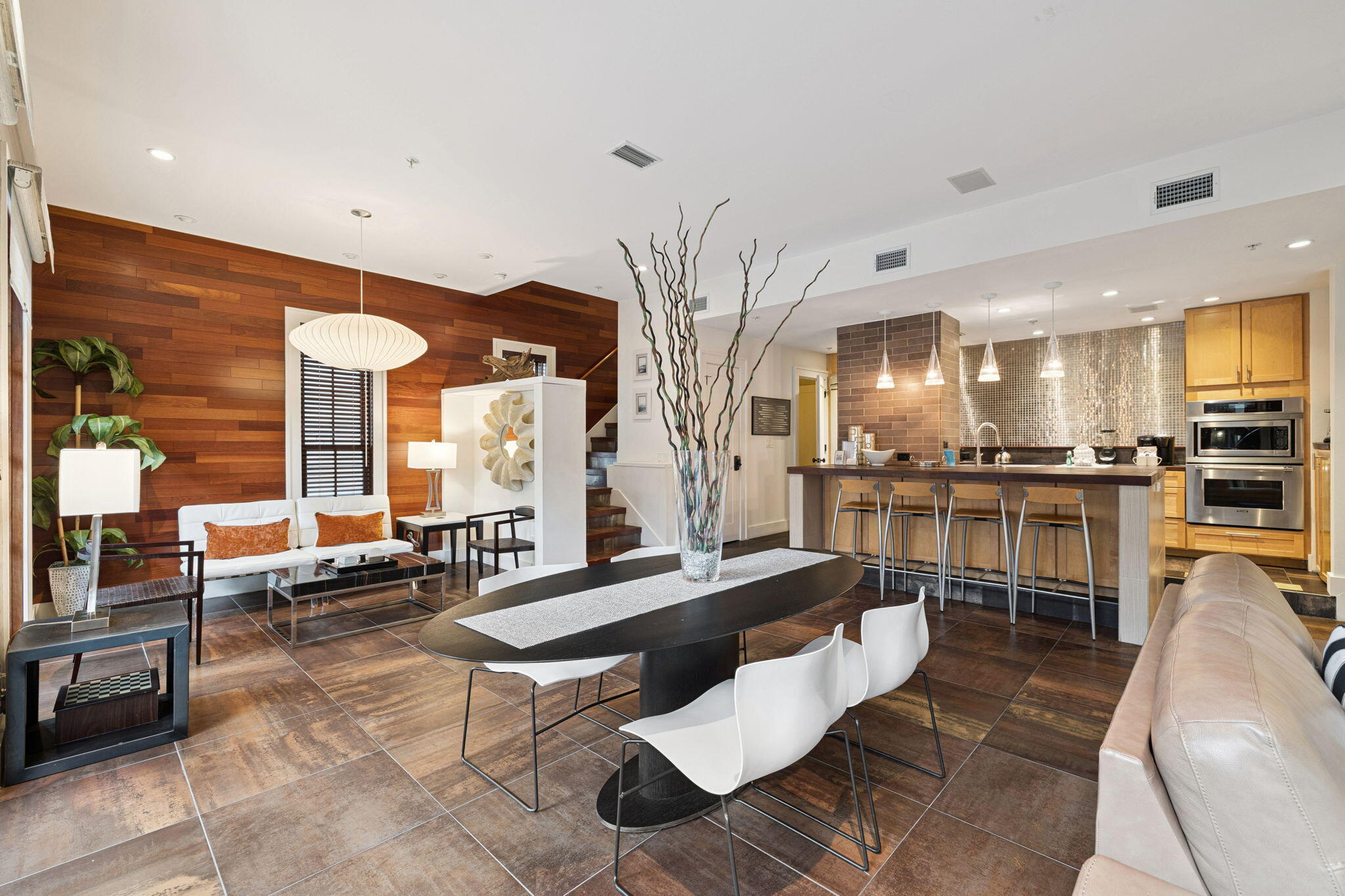 246 Fisherman's Cove, Unit 246 Miramar Beach, FL 32550 - Photo 8 of 72 a living room with stainless steel appliances kitchen island granite countertop a couch a dining table and chairs