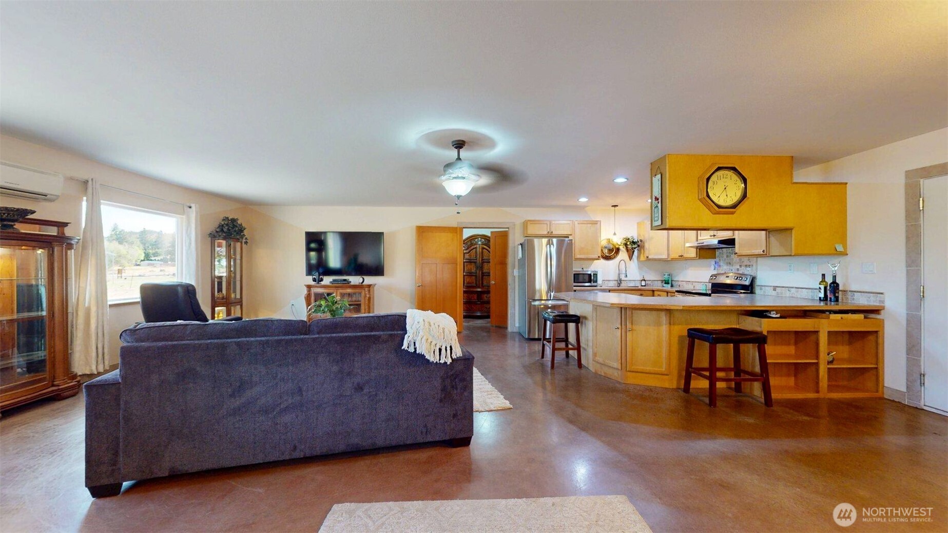 46 Shumway Road Omak, WA 98841 - Photo 8 of 40 a living room with stainless steel appliances kitchen island granite countertop furniture and a fireplace