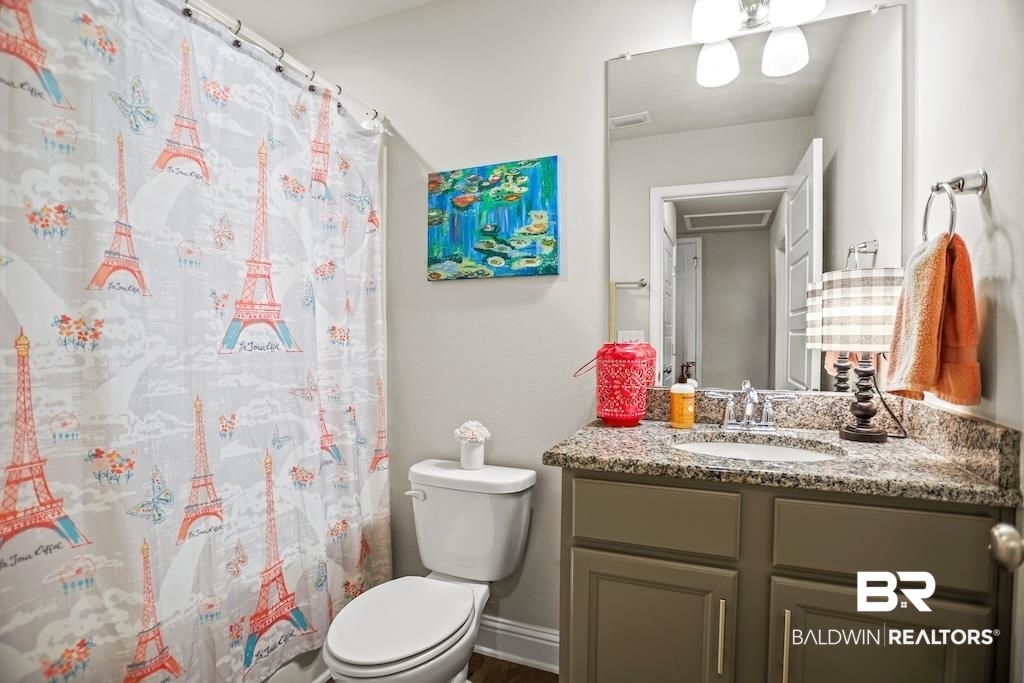 25806 Pollard Road, Unit 27 Daphne, AL 36526 - Photo 38 of 46 Bathroom with vanity and a shower with shower curtain
