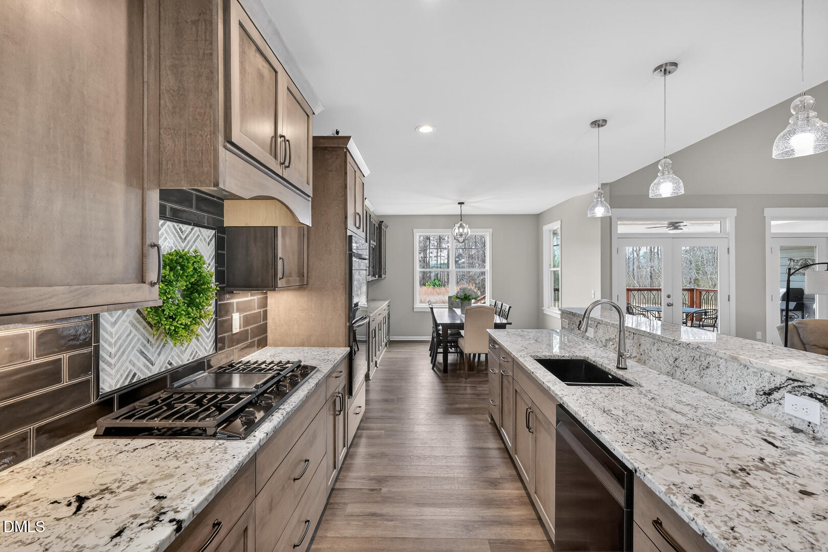 540 Pine Ridge Road Zebulon, NC 27597 - Photo 23 of 96 a large kitchen with stainless steel appliances granite countertop a lot of counter space