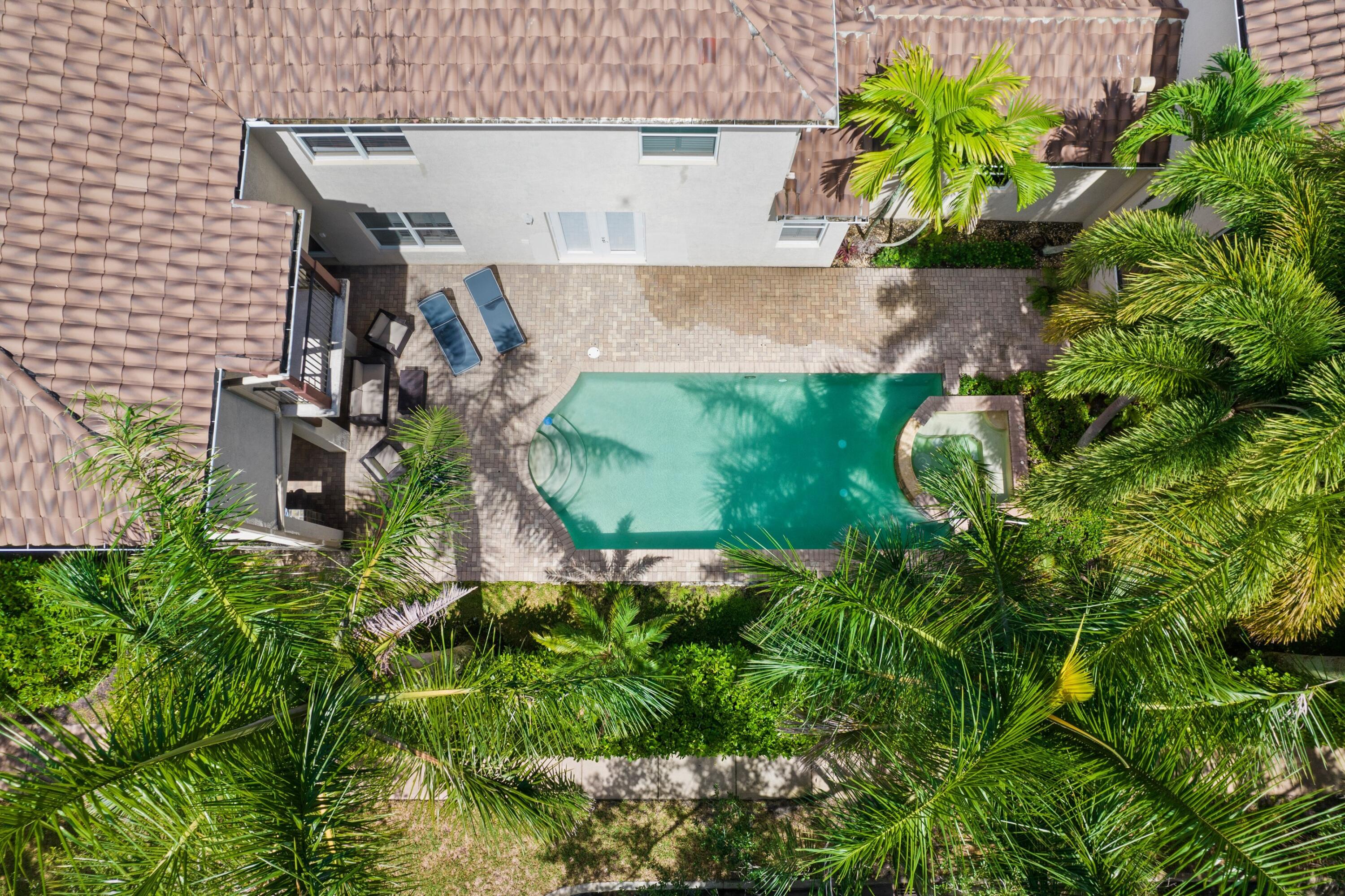 125 Bilboa Drive Jupiter, FL 33458 - Photo 2 of 5 an aerial view of a house with a yard