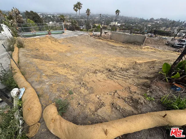 a view of a swimming pool with a yard