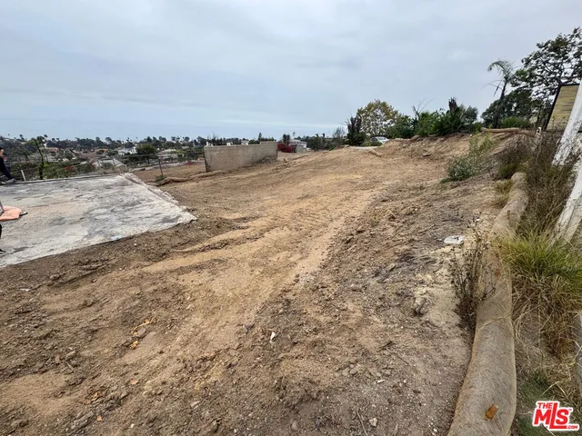 a view of ocean beach and mountain