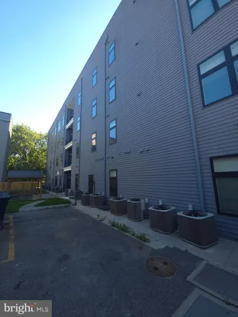 a view of a building with backyard
