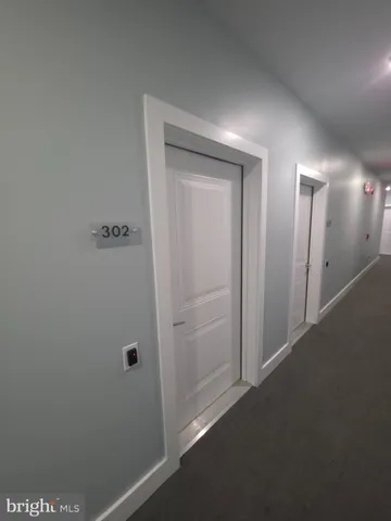 a view of hallway with closet