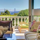 a living room with furniture fireplace and a floor to ceiling window
