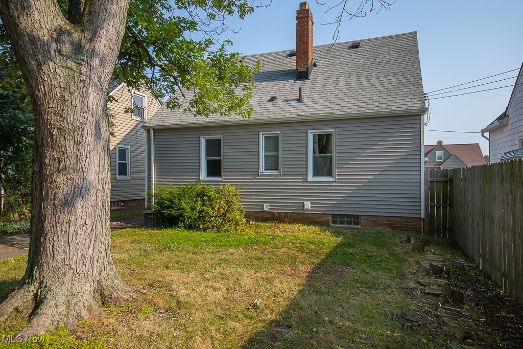 5607 Ridgewood Avenue Parma, OH 44129 - Photo 23 of 23 Rear view of property with a lawn