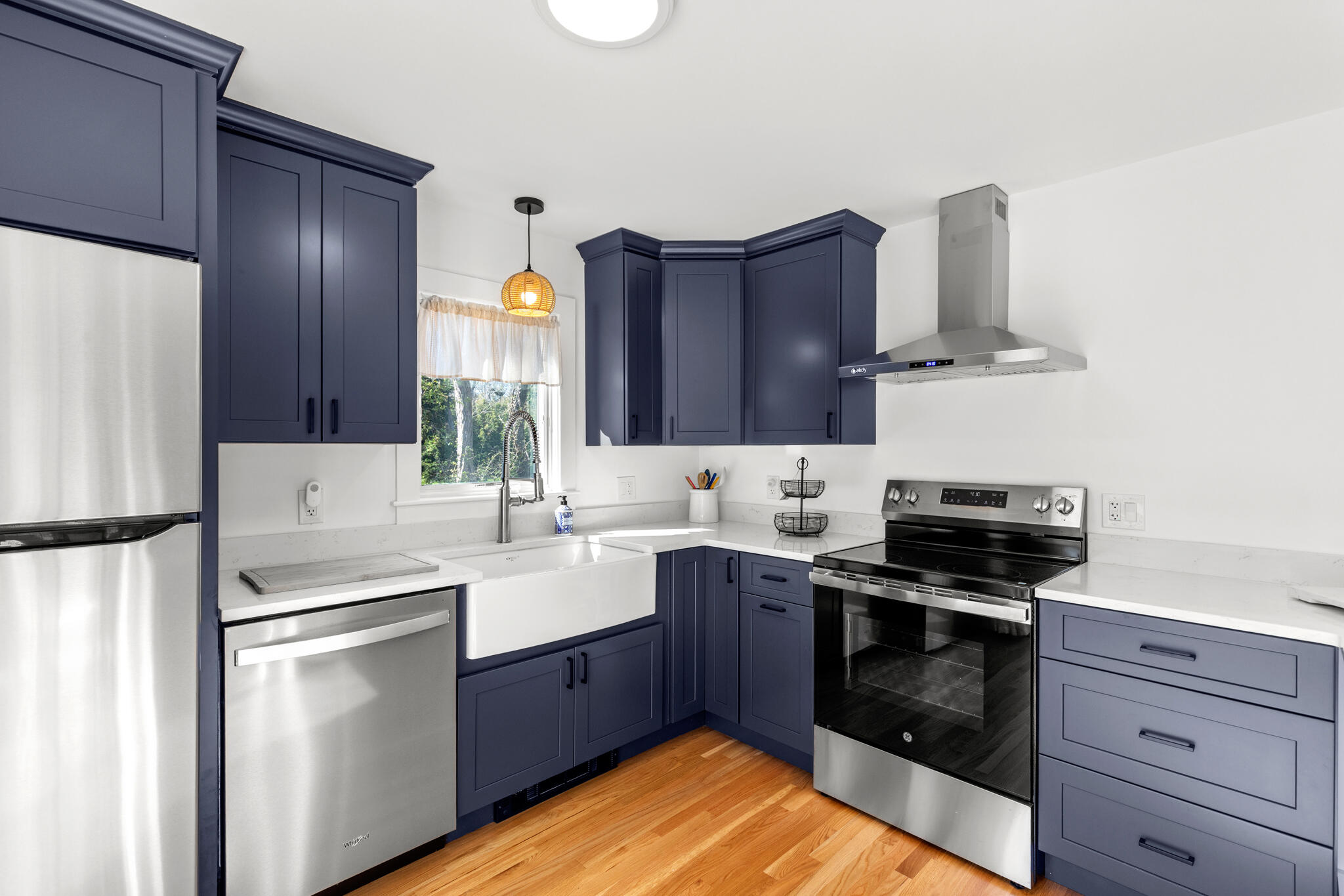 1295 Massasoit Road Eastham, MA 02642 - Photo 11 of 32 a kitchen with a sink stove and refrigerator