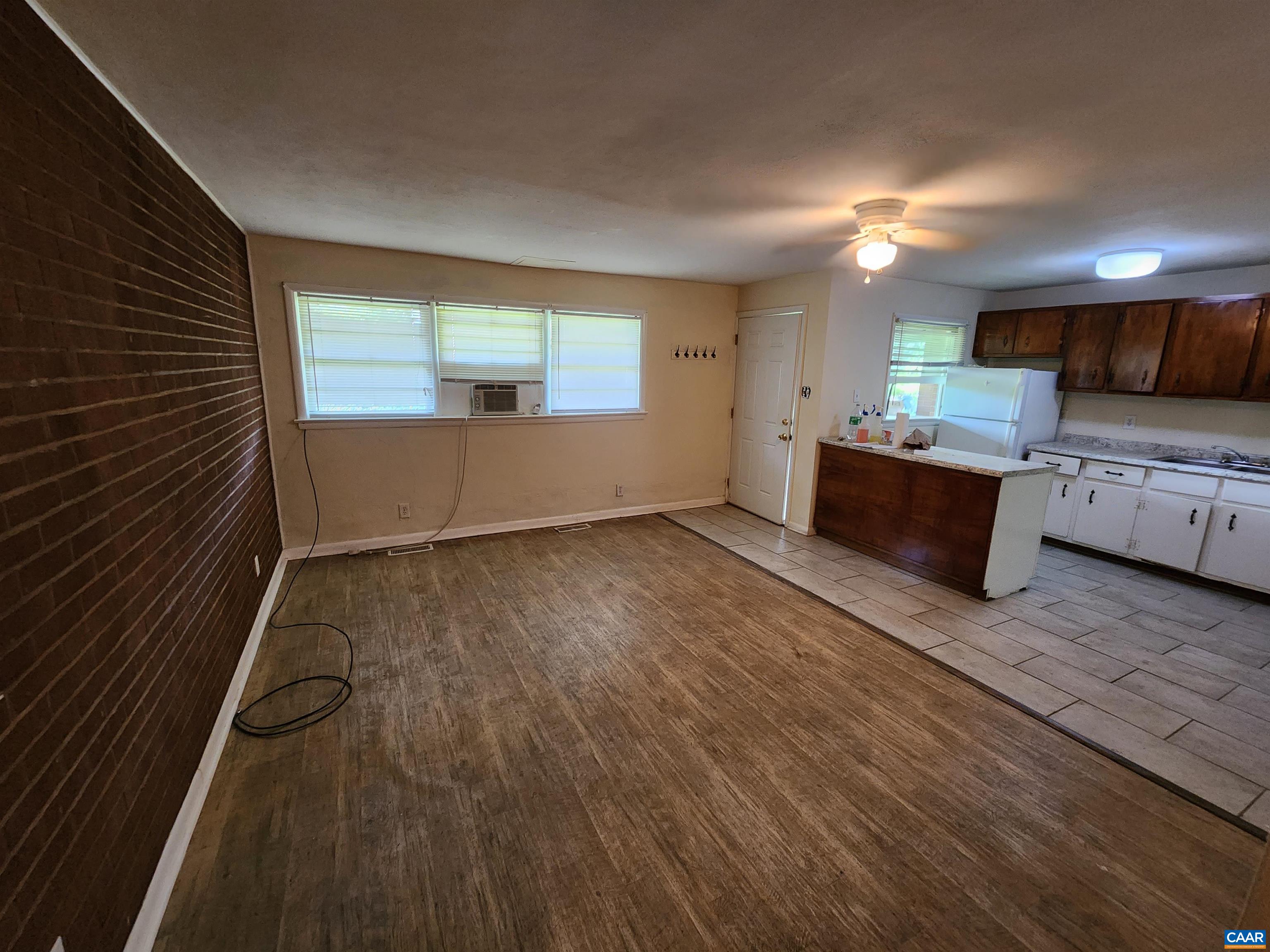 130 Apple Tree Road, Unit C Charlottesville, VA 22903 - Photo 7 of 11 a view of kitchen and wooden floor