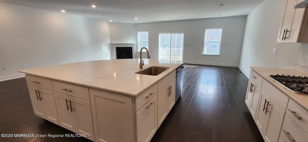 a kitchen with cabinets and window