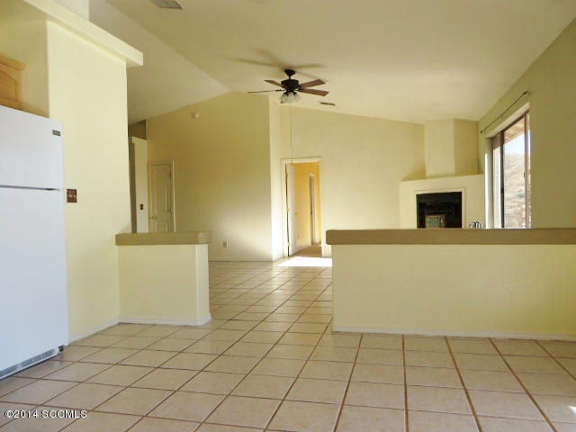 1255 Avenida Gloriosa Rio Rico, AZ 85648 - Photo 2 of 33 a view of a kitchen with furniture and a fireplace