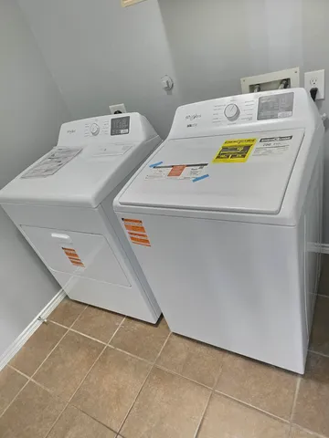 a utility room with washer and dryer
