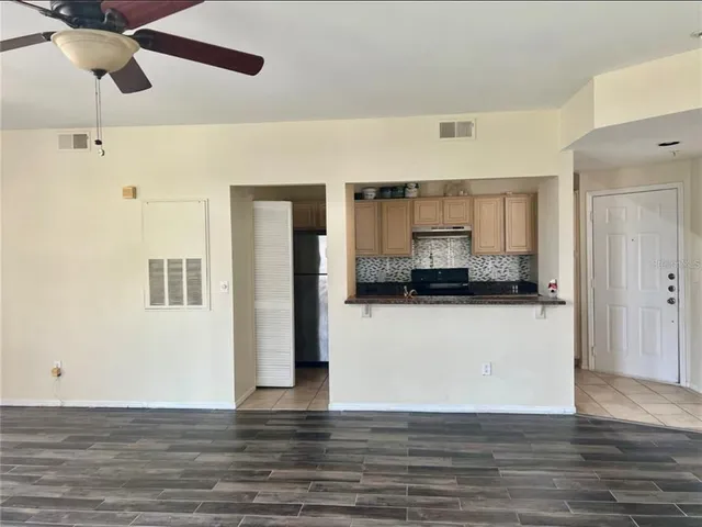 a view of a kitchen with wooden floor