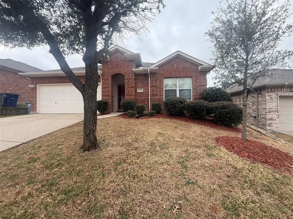 6506 Portside Ridge Lane Dallas, TX 75249 - Photo 1 of 23 a front view of a house with a yard