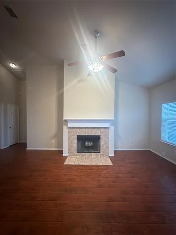 a view of empty room with a fireplace