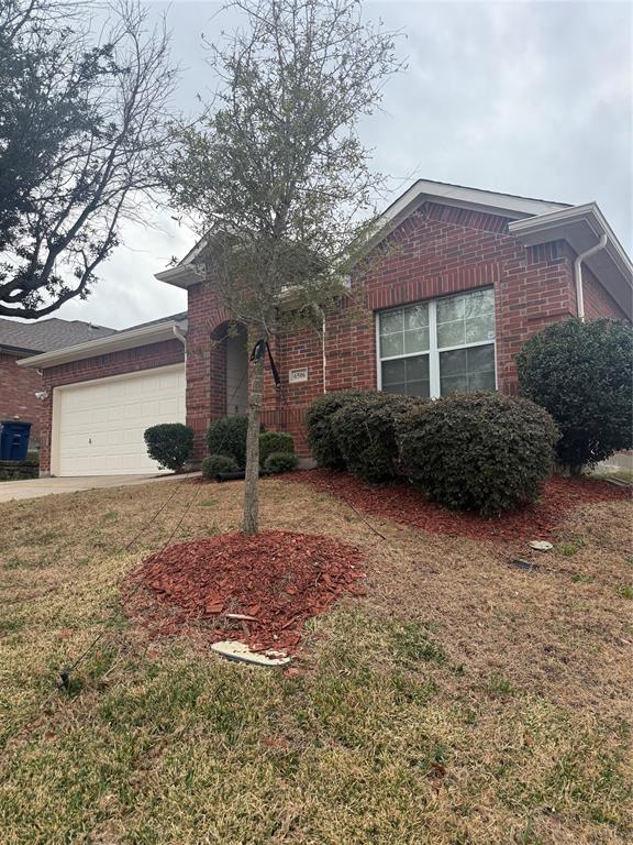 6506 Portside Ridge Lane Dallas, TX 75249 - Photo 5 of 23 a front view of a house with garden