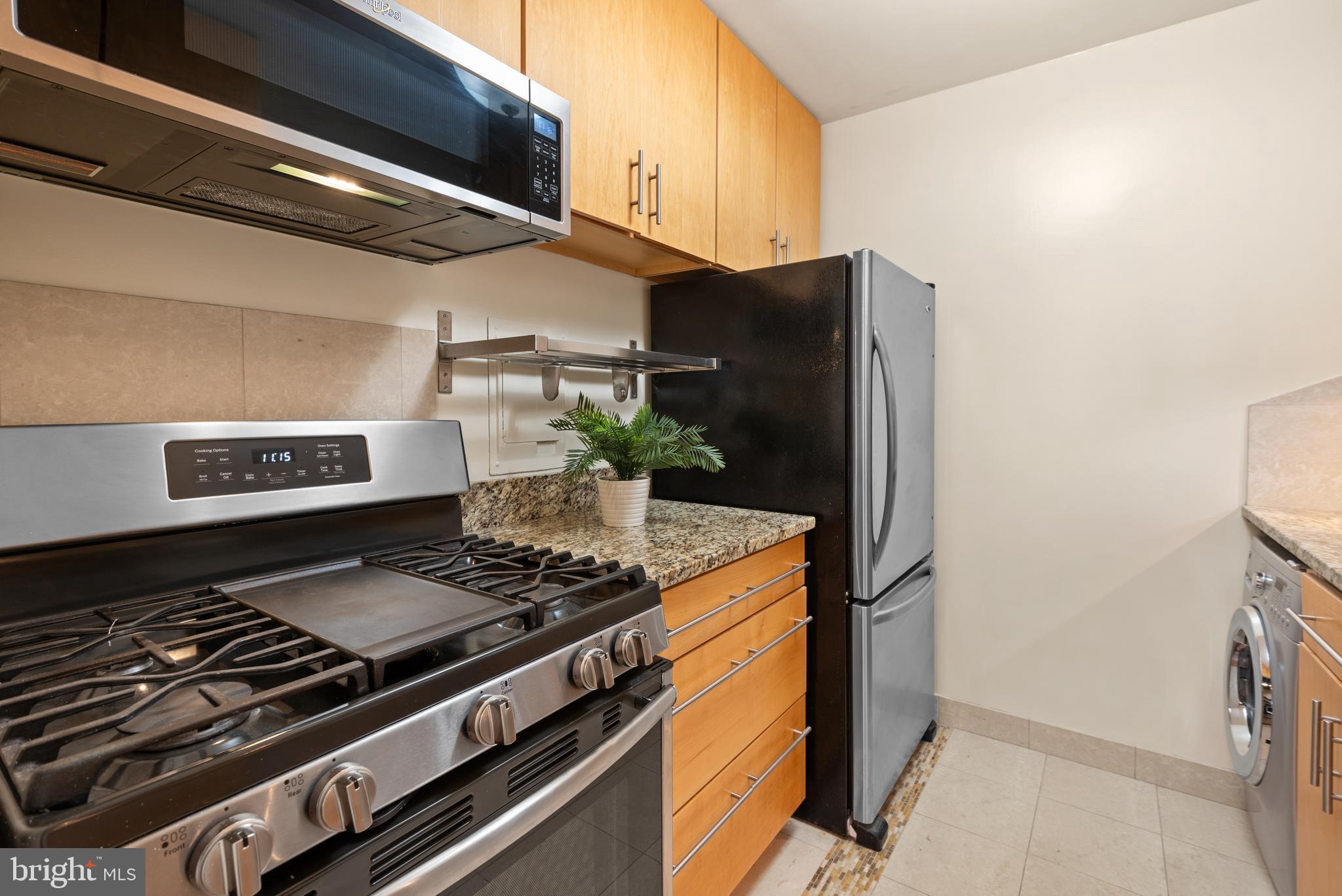4570 MacArthur Boulevard Northwest, Unit 105 Washington, DC 20007 - Photo 12 of 20 Gorgeous granite and stainless kitchen