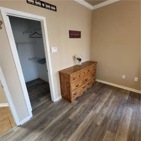 a room with hard wood floors and stairs