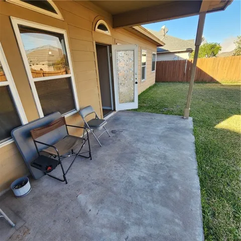 a view of an outdoor space with porch and wooden floor
