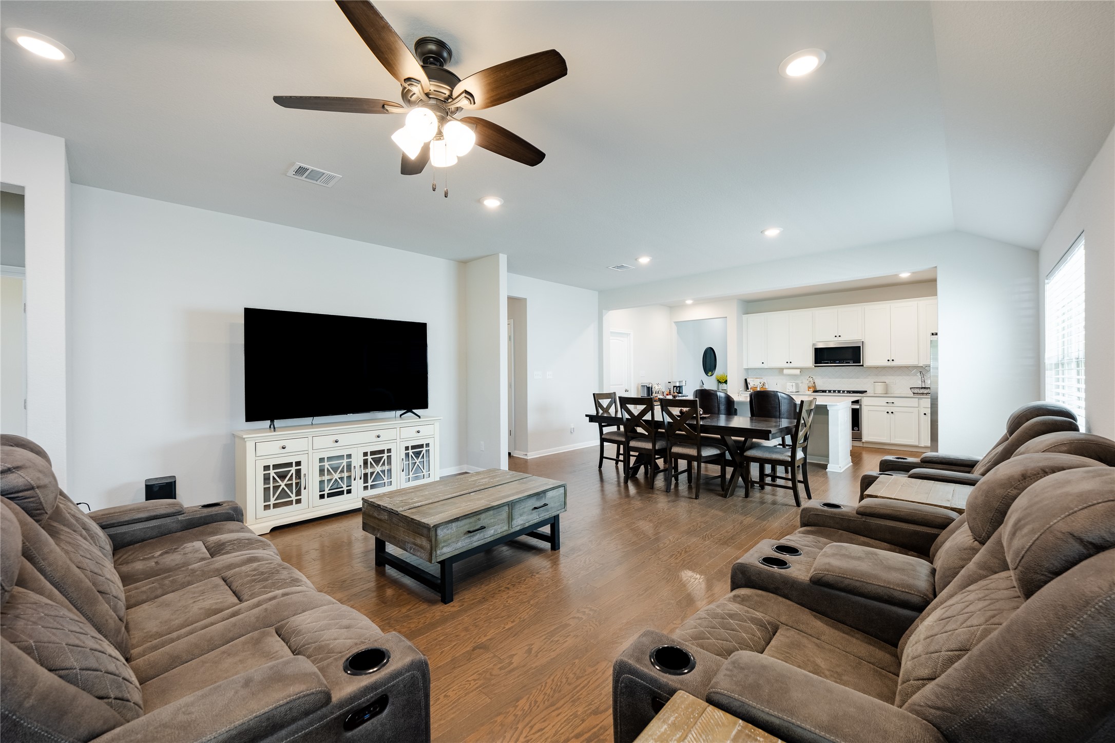 2021 Cartway Court Leander, TX 78641 - Photo 10 of 31 Living room featuring recessed lighting, visible vents, a ceiling fan, and wood finished floors