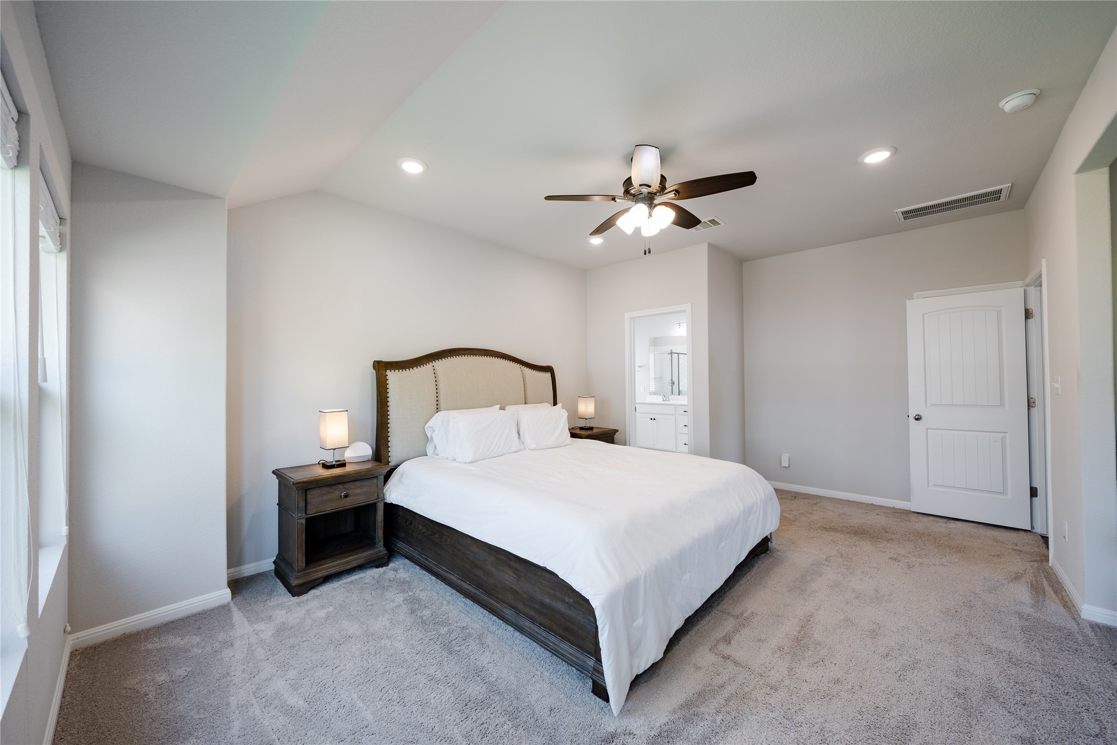 2021 Cartway Court Leander, TX 78641 - Photo 14 of 31 Bedroom with carpet flooring, baseboards, visible vents, and recessed lighting
