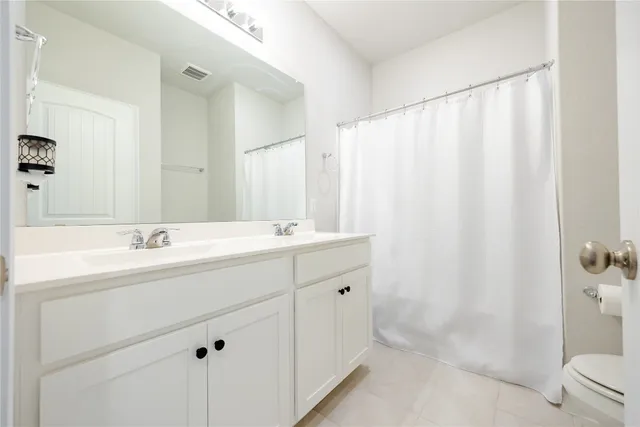 a view of walk in closet with clothes