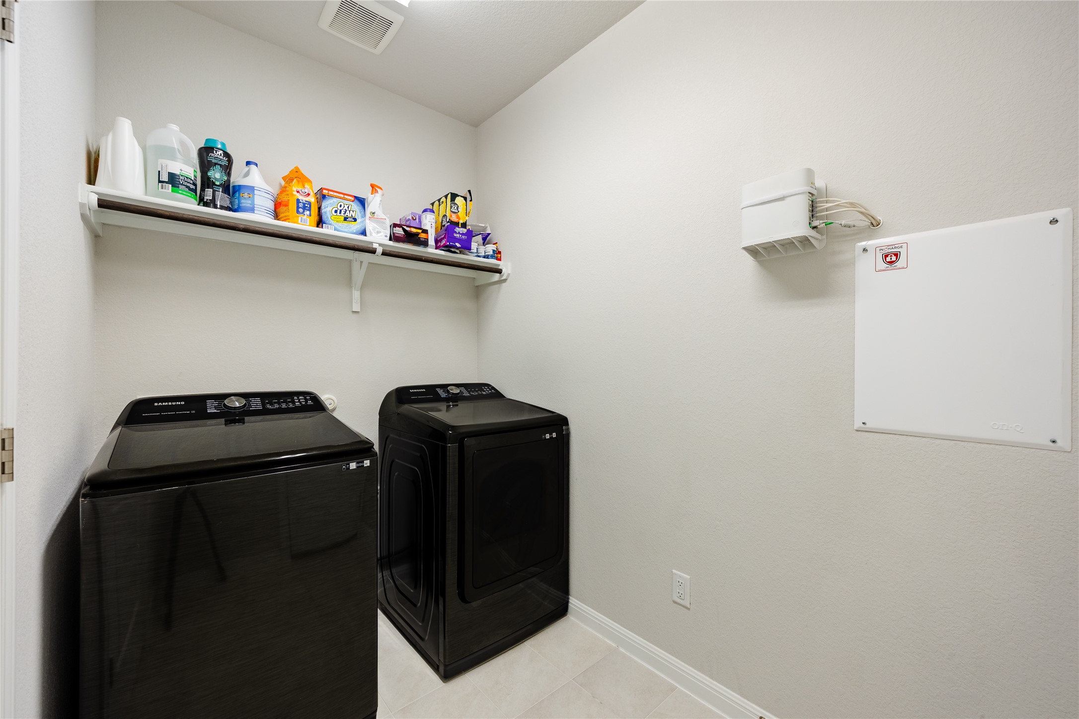 2021 Cartway Court Leander, TX 78641 - Photo 24 of 31 Clothes washing area featuring baseboards, light tile patterned floors, visible vents, independent washer and dryer, and laundry area