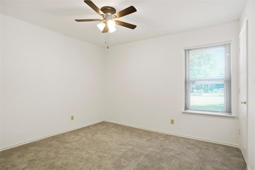 2109 Malone Street Denton, TX 76201 - Photo 18 of 36 an empty room with a window and a fan