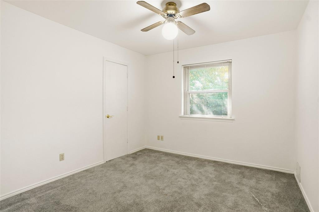 2109 Malone Street Denton, TX 76201 - Photo 19 of 36 an empty room with a window and a fan