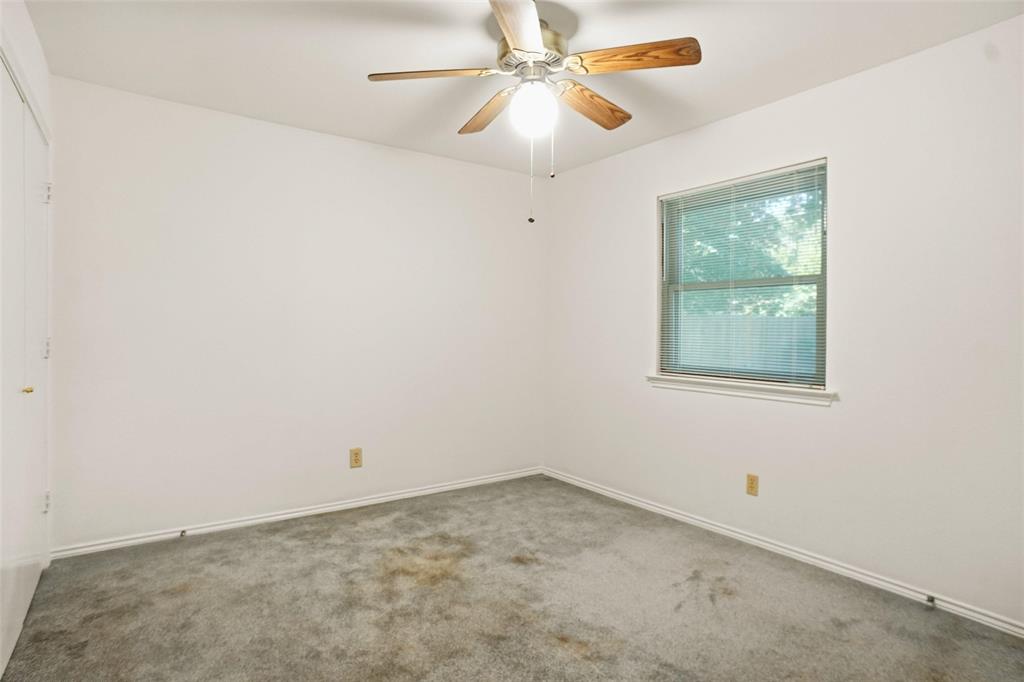 2109 Malone Street Denton, TX 76201 - Photo 20 of 36 an empty room with a window and a fan