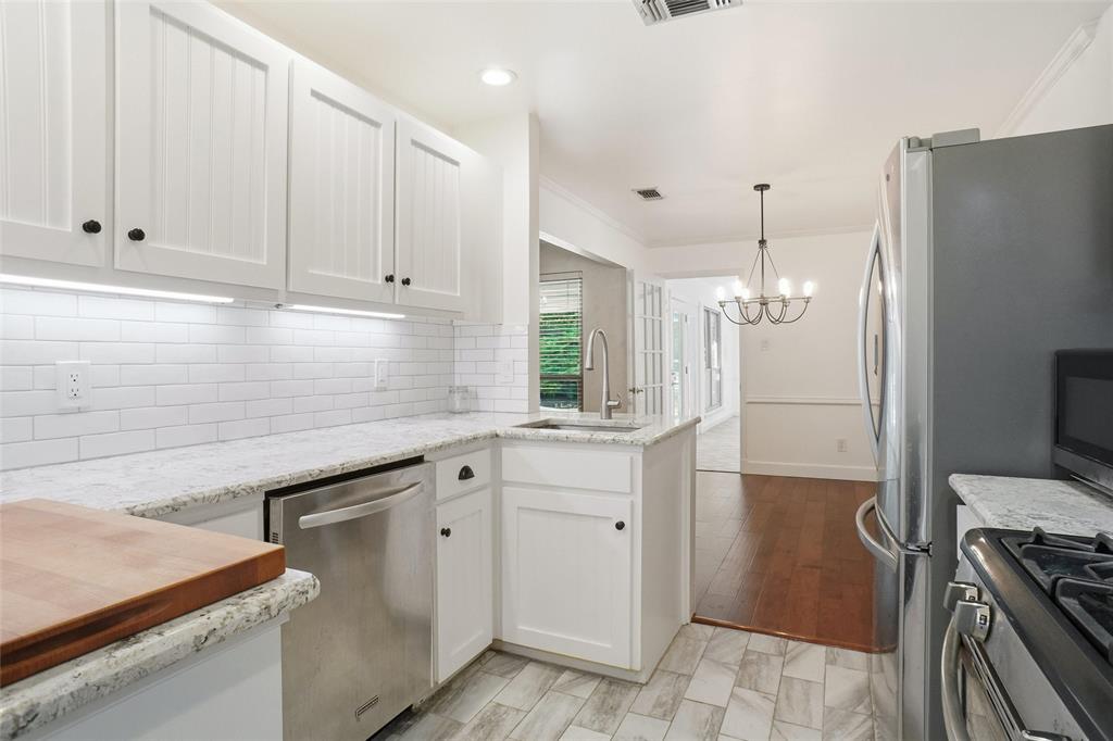 2109 Malone Street Denton, TX 76201 - Photo 4 of 36 a kitchen with a sink and cabinets