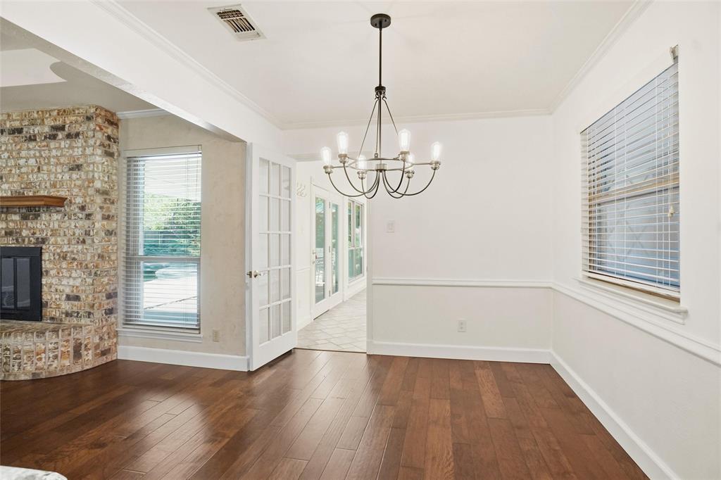 2109 Malone Street Denton, TX 76201 - Photo 10 of 36 a view of empty room with wooden floor and fireplace