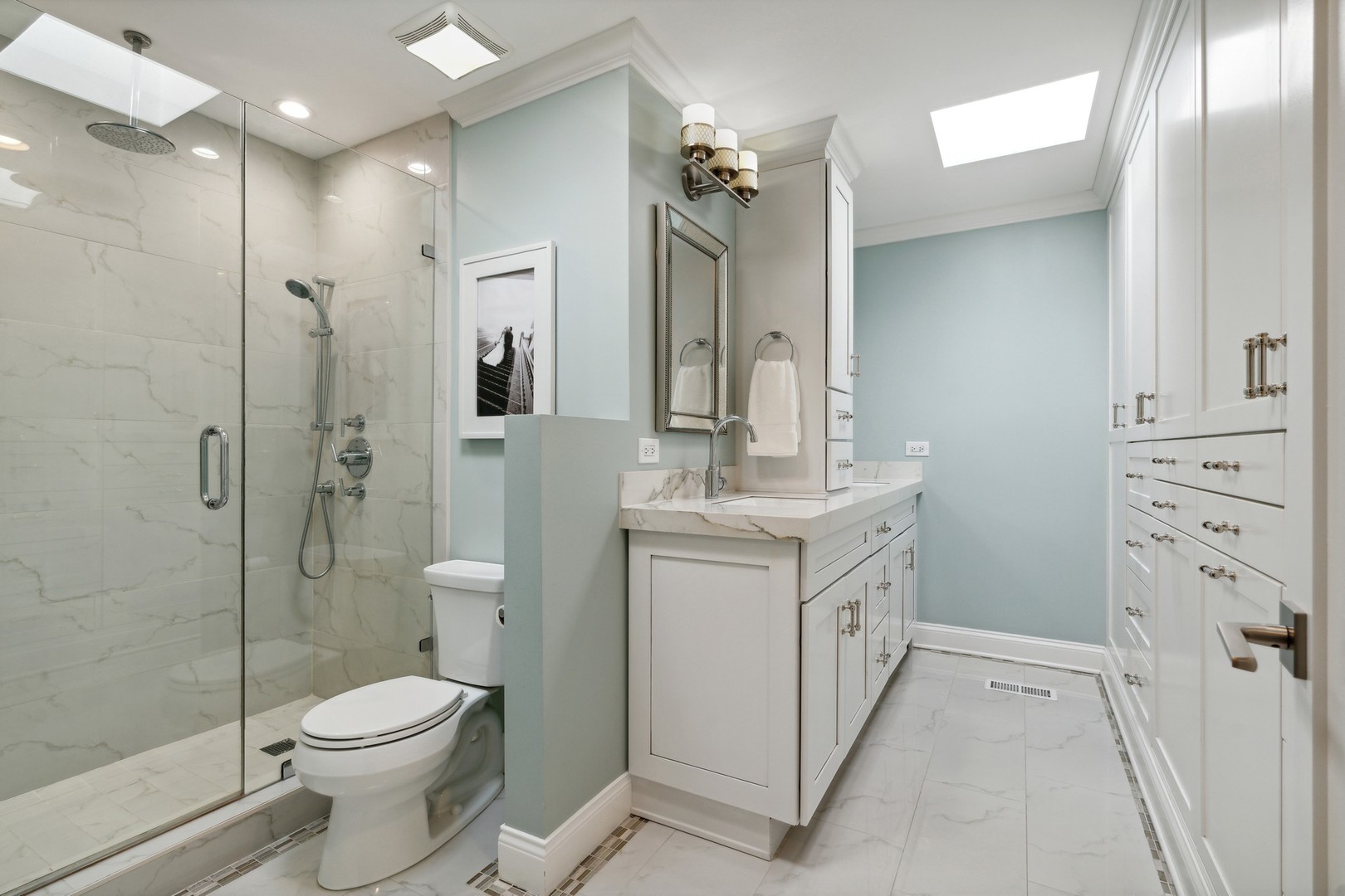 641 West Willow Street, Unit 105 Chicago, IL 60614 - Photo 20 of 37 a bathroom with a double vanity sink toilet and shower