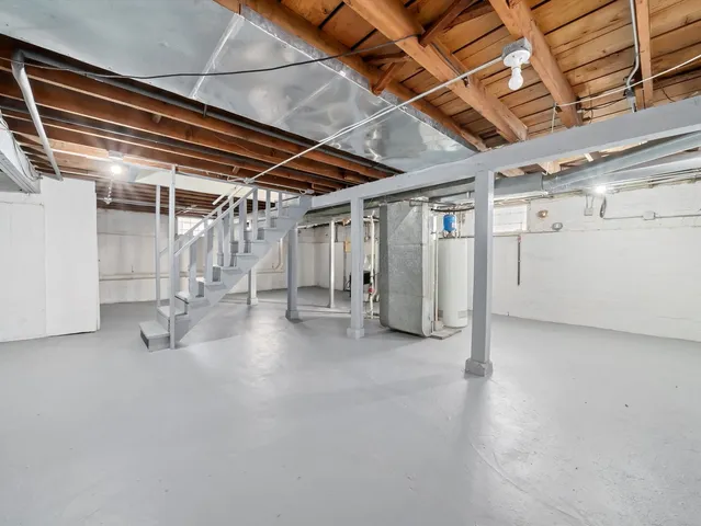 a view of empty room with wooden ceiling