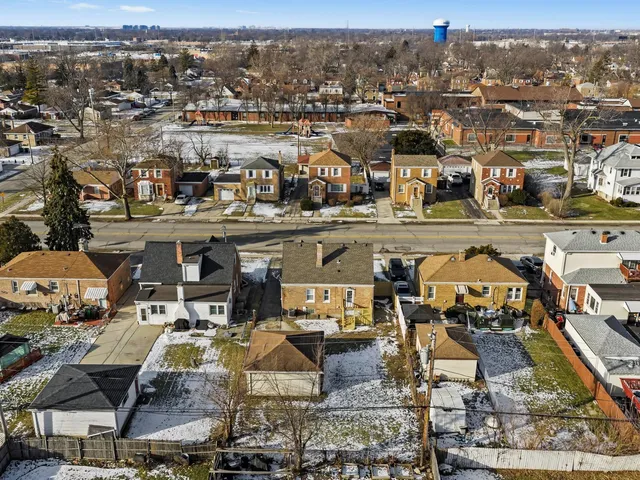 an aerial view of a house with lake view