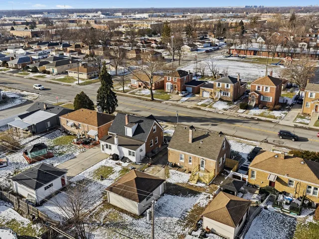 an aerial view of a city with lots of residential buildings