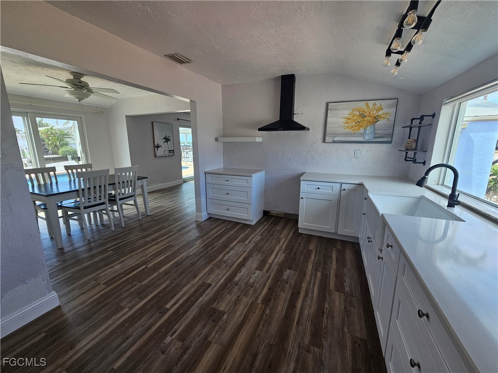 4673 Pine Island Road Matlacha, FL 33993 - Photo 12 of 29 a spacious bathroom with a double vanity sink a mirror and a bathtub
