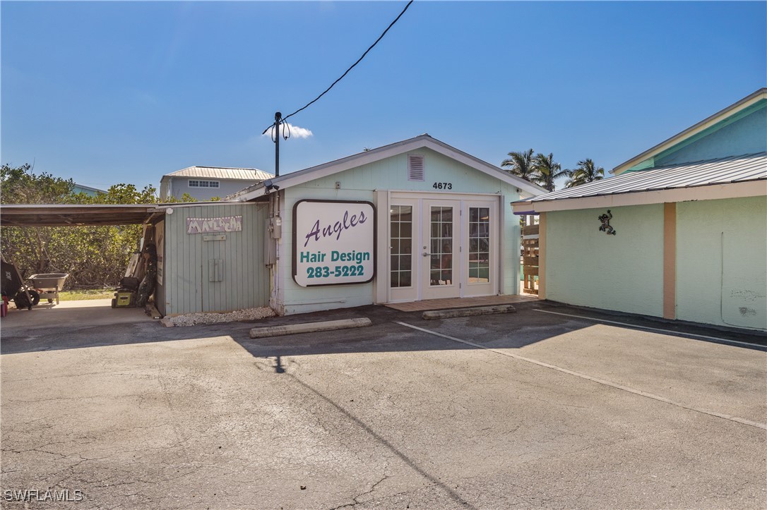 4673 Pine Island Road Matlacha, FL 33993 - Photo 19 of 29 a view of a house with a garage
