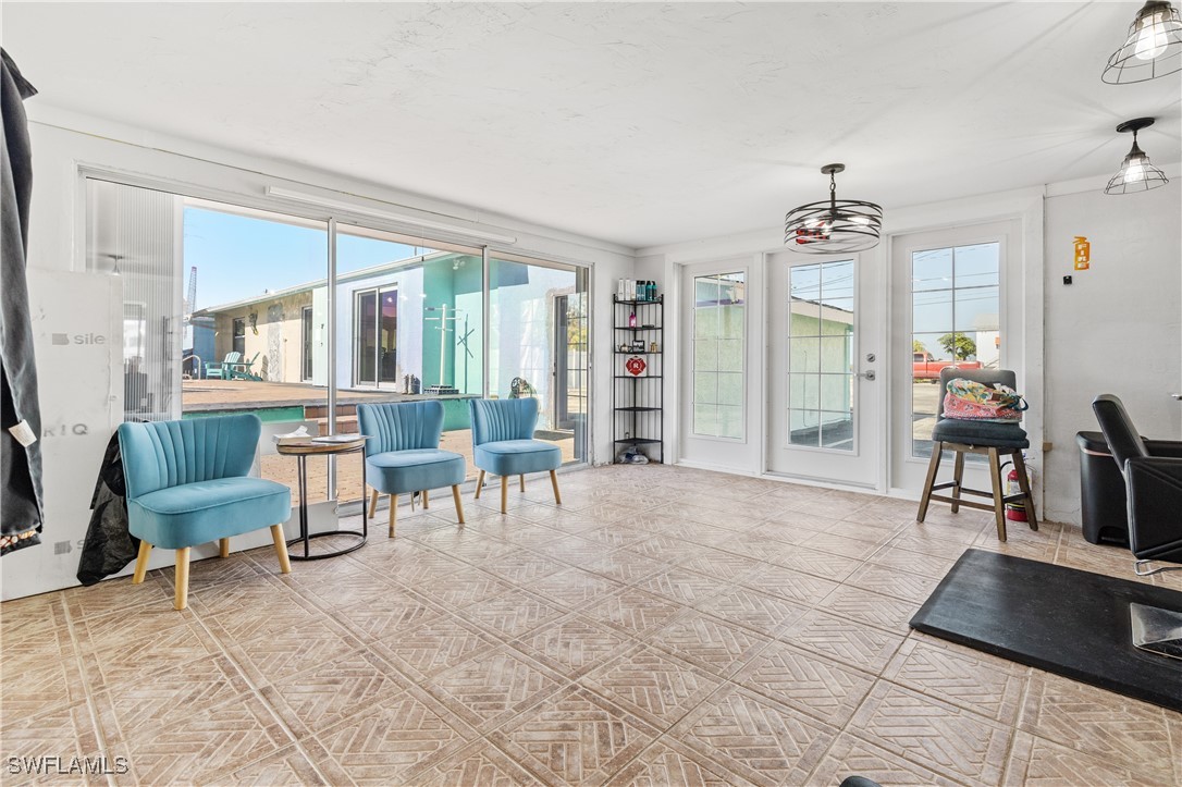 4673 Pine Island Road Matlacha, FL 33993 - Photo 21 of 29 a living room with furniture and a table