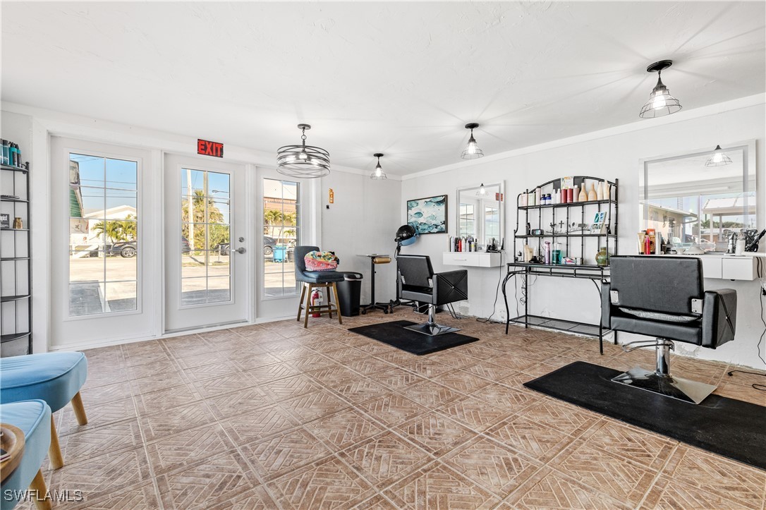 4673 Pine Island Road Matlacha, FL 33993 - Photo 22 of 29 a view of a livingroom with workspace and a window